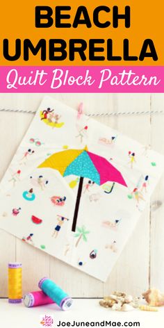 the beach umbrella quilt block pattern is on display with other sewing supplies and thread spools