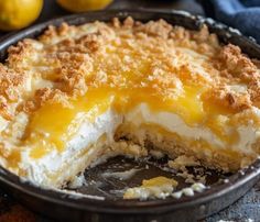 a close up of a pie in a pan with one slice missing from the pie