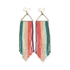 two pairs of multicolored beaded earrings hanging from metal hooks on a white background