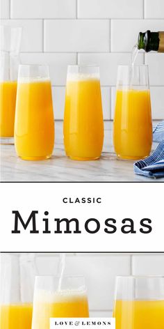 glasses filled with orange juice sitting on top of a counter