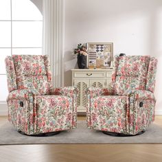 two recliners sitting on top of a rug in a living room next to a dresser