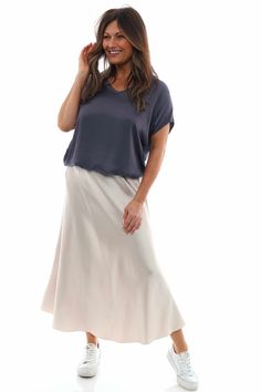 Make a statement with the Made in Italy Ottilie Skirt! Featuring a luxurious silk like fabric and elasticated waistband, the skirt is perfectly simple yet stylish. Don't miss out on this essential piece this season! - Elasticated waistband - Silk like fabric Versatile Relaxed Maxi Skirt With Lining, Versatile Relaxed Maxi Skirt With Lined Detail, Casual Flowy Viscose Maxi Skirt, Flowy Viscose Bottoms For Day Out, Versatile Relaxed Fit Lined Maxi Skirt, Flowy Rayon Lined Skirt, Viscose Flowy Maxi Skirt With Lining, Chic Rayon Lined Skirt, Rayon Skirt With Elastic Waistband