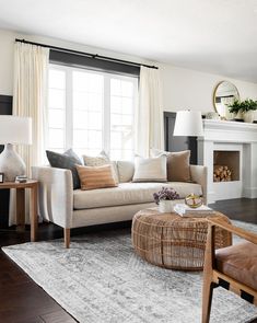 a living room filled with furniture and a fire place