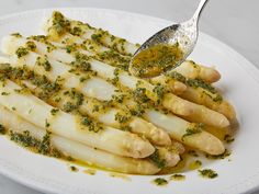 a white plate topped with food and a spoon