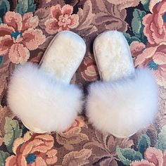 You can walk on clouds all winter in our 100% alpaca fur, open-toe slippers made in Peru. Featuring all-natural fluffy white fur on the outer strap and insole, and a durable suede bottom sole. Alpacas live in their natural habitat in the Andes mountains of Peru and are a prized animal to the people and their culture. When the animals reach the end of their natural lifecycle, the fleece can be used to make ethically produced and cruelty free products. Alpaca fiber is hypo-allergenic and easy to c Fluffy Faux Fur Slip-on Slippers, Super Soft Open Toe Winter Slippers, Fluffy Faux Fur Open Toe Slippers, Soft Open Toe Indoor Slippers, Soft Sheepskin Slippers With Round Toe, Cozy White Slippers With Plush Lining, Fluffy White Indoor Slippers, Comfortable Fluffy White Slippers, White Fluffy Indoor Slippers