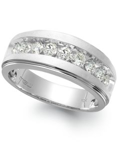 a white gold ring with channeled diamonds