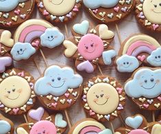 many decorated cookies are arranged on a table