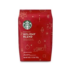 starbucks holiday blend coffee bag with red background and white snowflakes on the side