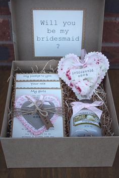 an open box with some items in it and a sign on the inside that says will you be my bridesmaid?