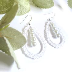 Lace Pearl Earrings Length Aprox 3 inches Light Weight Sterling Silver Ear wire Handmade crochet lace design String of 4 pearls dangle in the middle It's a special day and these earrings are the perfect finishing touch! These gorgeous earrings will give your bridal look an extra touch of sophistication and glamour. They are so elegant and timeless, you won't regret adding them to your wedding day ensemble! Whether you're dressing up for a special occasion or just want to add a touch of glam to a Elegant Crochet Dangle Earrings, Elegant White Crochet Lace Jewelry, Drops Design, Bridal Look, Crochet Techniques, Gorgeous Earrings, Lace Design, Bridal Looks, Ear Wire