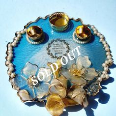 a blue tray with flowers and candles on it