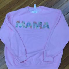 a pink sweatshirt with the word jamaica printed on it