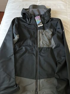 Mountain Hardwear Dragon Soft Shell Hooded Jacket: Men's Black Size Small. Discontinued. New never opened. Comes with all tags. Features Lightweight, stretchy AirShield soft-shell fabric incorporates a wind- and weatherproof membrane for serious protection Strategically-mapped Chockstone fabric in areas of high abrasion or stretch adds durability Abundant pocketing ticks the alpinist checklist: 2 interior stretch dump pockets, a zippered interior, a zippered chest and 2 zippered hand pockets Alp Black Hooded Track Jacket With Pockets, Black Hooded Track Jacket With Double-lined Hood, Black Double-lined Hooded Outerwear For Hiking, Black Hooded Track Jacket With Adjustable Hood, Black Hooded Outerwear For Hiking, Black Hooded Jacket With Pockets For Hiking, Black Outerwear With Double-lined Hood For Hiking, Black Hooded Track Jacket For Outdoor Activities, Black Urban Hooded Jacket For Hiking