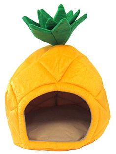 a yellow pineapple shaped cat bed with a green top