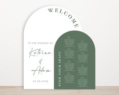 an arch - shaped welcome card with the names and date printed on it