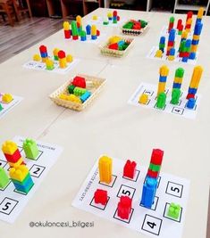 a table with legos and building blocks on it