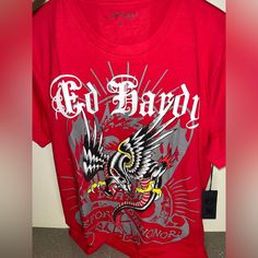 Nwt Ed Hardy Red And Black Mens / Unisex T-Shirt Size Medium New With Tags Y2k Goth Red Graphic Tee For Fan Merchandise, Red Graphic Print Band Merch Tops, Red Graphic Print Shirt For Fan Merchandise, Red Cotton Band Merch Shirt, Red Band Merch Tops With Logo Print, Red Graphic Print Band Merch Shirt, Red Short Sleeve Band Merch Top, Hardy Shirts, Eagle Graphic Tee