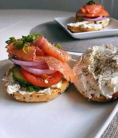 an open face sandwich with tomatoes, cucumber and smoked salmon on rye bread