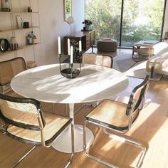 a dining room table with chairs around it