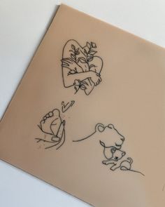 a drawing of two bears and a heart on a piece of paper that has been drawn onto it