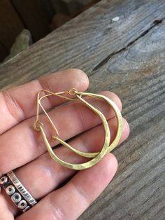 This style hoop earrings are a classic design and perfect for everyday wear. Each pair is forged by hand from recycled metals. Choose from rustic or raw copper or rustic or raw gold brass. Hoops are made to order just for you! Custom sizes available. Copper is the traditional gift for the 7th anniversary. It is also a versatile metal which makes it perfect for any occasion. MEASUREMENTS & SPECIFICS: Shown in rustic copper and raw brass. SIZE: approximately 3.5 x 4 cm (custom sizes available Small Hoop Jewelry For Everyday Use, Simple Adjustable Small Hoop Jewelry, Adjustable Simple Small Hoop Jewelry, Hammered Brass Hoop Earrings Gift, Brass Hoop Earrings With Hammered Detail As Gift, Hammered Artisan Hoop Earrings For Everyday, Artisan Hammered Hoop Earrings For Everyday, Hand Forged Brass Jewelry For Everyday, Everyday Artisan Hammered Hoop Earrings