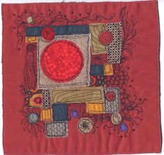 a red piece of cloth with an image of a square in the center and circles on it