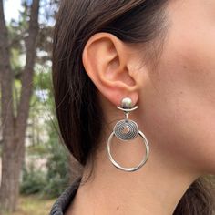 The silver hoop earrings for Nomada Bohemio were a must-have at the top of my list. I wanted to create a design that stands out with Bohemian and Ethnic details, rather than a standard and easily found basic model. As a result, it has become the most requested boho dangling earring model. Handcrafted with silver plated brass material, you won't feel these earrings on your ears all day and night, while others will certainly notice. Get ready to attract attention and admiration! Perfect Gift: Thes Bohemian Adjustable Metal Wrap Earrings, Bohemian Single Wrap Earring In Metal, Silver Bohemian Wrap Earrings, Adjustable Bohemian Metal Wrap Earrings, Bohemian Metal Wrap Earrings, Bohemian Circle Earrings, Bohemian Metal Wrap Earrings With Ear Wire, Bohemian Round Hoop Earrings, Hypoallergenic, Bohemian Metal Clip-on Earrings