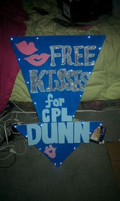 a blue bunting banner with free kisses for g p l d dunn on it