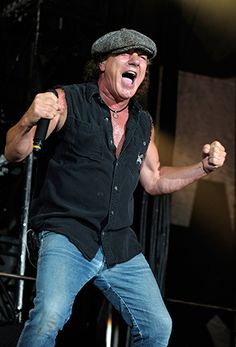 an image of a man that is on stage with his mouth open and hands in the air