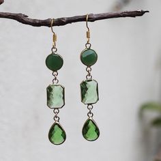 These cute hand-crafted faceted green multi-tier Crystal Earrings come in multiple designs Stone: Crystal Colour: Green Metal: Gold Plated Earring Size: 3 crystals: 7.5cm Drop x 1.2cm Width                          2 crystals: 6cm Drop x 1.2cm Width Green Gemstone Drop Crystal Earrings, Handmade Green Crystal Drop Earrings, Green Crystal Earrings For May Birthstone Gift, Green Crystal May Birthstone Earrings For Gift, Green Dangle Crystal Earrings For Gift, Nickel-free Green Drop Crystal Earrings, Green Faceted Drop Earrings, Green Faceted Earrings For May Birthstone, Green Metal