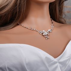 "Crystal with pearl bridal jewelry set: necklace, bracelet and earrings.  Gorgeous bridal or MOB jewelry set for your wedding day. Necklace measures about 17\" long.  Earrings are about 1\" long and 1/2\" wide. Matching regular bracelet is measuring: 7\" long and 1/4\" wide or an adjustable bolo matching bracelet is available as well. High quality guaranteed by GlamourBrideUSA! SHIPPING: Standard Shipping: 4-6 business days Priority mail Shipping: 2-3 business days *INTERNATIONAL ORDERS: PLEASE Pearl White Crystal Bridal Necklace For Wedding, Silver Bridal Accessories With Pearl Drop, Silver Pearl Drop Bridal Accessories, Silver Bridal Accessories With Pearl Drop For Brides, Silver Pearl Drop Bridal Accessories For Brides, Silver Pearl Wedding Jewelry Sets, Silver Pearl Bridal Accessories For Bride, Silver Pearl Necklace For Mother Of The Bride, Wedding Crystal Jewelry Sets With Pearl Drop