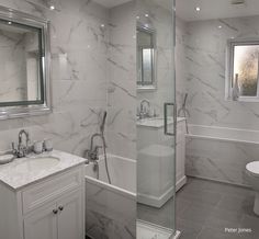 two pictures of a bathroom with marble walls and floor