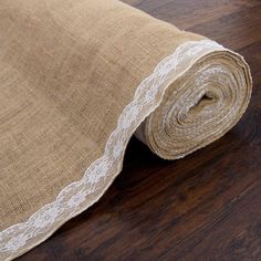 a roll of burlock on top of a wooden floor