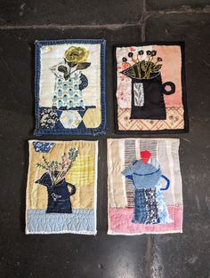 three small quilts with flowers and vases on them