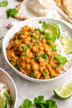 a white bowl filled with rice covered in sauce and garnished with cilantro