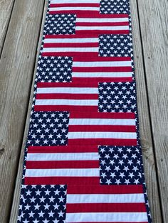 an american flag table runner on a wooden deck