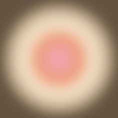 an orange and white circle is shown in the middle of a blurry image,