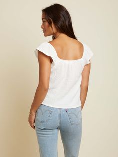 This tank is your sign to book that vacation. Featuring an elastic, square neckline, flutter sleeves and a relaxed fit in the breeziest double gauze. (This one comes in White.) Wear it with the Safa Skirt. | Women's Wyoming Tank in White | Ethical Essentials Summer Tops With Square Neck For Day Out, Square Neck Summer Tops For Day Out, Square Neck Tops For Beach In Spring, Casual Square Neck Top For Vacation, Casual Square Neck Vacation Tops, Spring Vacation Tops With Square Neck, Summer Top With Relaxed Fit And Square Neck, Summer Top With Square Neck And Relaxed Fit, Summer Square Neck Top For Day Out