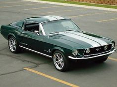 a green mustang parked in a parking lot