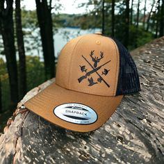 This awesome fishing and hunting design is embroidered on premium quality Yupoong six-panel trucker hat. The design placement is on the right side of the hat when looking at it.  How to Order: 1. Choose your hat color from the pictures. (We have a lot more colors available. Send us a message to check what we have available)  2. Pick the thread color you would like for the design.  Message us with if you have any questions.  Washing instructions: Hand wash cold only, wipe dirty areas only with a Trucker Hat With Flat Bill For Hunting, One Size Fits Most Snapback Fishing Hat, One Size Fits Most Snapback Fishing Cap, Trucker Cap For Hunting, Trucker Hat With Curved Brim For Hunting, Trucker Cap For Camping, Adjustable Flat Brim Trucker Hat For Fishing, Fishing Trucker Cap With Curved Bill, Trucker Baseball Cap For Fishing With Curved Bill