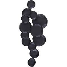 an abstract sculpture made out of black circles