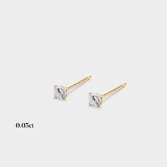 These mini studs are perfect for adding a little sparkle on their own or as an accent in your second piercing! Classic Diamond Piercings For Everyday Wear, Classic 14k Gold Piercings With Single Diamond, Tiny Classic 14k Gold Piercings, Minimalist 14k Gold Piercing With Single Diamond, Minimalist 14k Gold Single Diamond Earrings, Minimalist 14k Gold Piercings With Single Diamond, Dainty Yellow Gold Piercings With Single Diamond, Classic Gold Piercing With Single Diamond, Minimalist Yellow Gold Piercings With Prong Setting