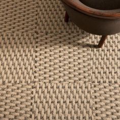 a close up of a chair on a carpet