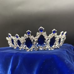 Faux sapphires in a silver toned metal setting. Small combs on each end keep the tiara firmly in place. SHOP POLICIES: Orders placed Monday-Friday generally ship next day. Orders placed Saturday/Sunday ship the following Tuesday. Cancellations are permitted before an item ships. Please note that we do not accept returns. Sapphire Tiara, Sapphire Wedding Crown, Sapphire Blue Dress Tiara, Sapphire Crown, Saphhire Crown, Blue And Silver Crown, Dark Blue Tiara, Blue Crown Aesthetic Queen, Stylish Jewelry Accessories