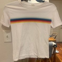 A Baby Doll Or Slightly Cropped Fit. Nice Thick Material. Never Worn. Size Is One Size O/S Stripe Tee, Brandy Melville Tops, Rainbow Stripes, Striped Tee, Baby Doll, Brandy Melville, Brandy, Baby Dolls, Color White