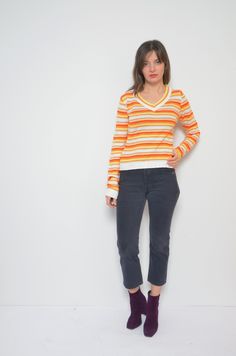 "2yk striped multi color sweater. Vintage 2000s colorful v-neck pullover. - Label: zozo - Era: 2000s - Color: white, orange, yellow - Fabric: acrylic - Condition: very good. Ready to wear. - Tag Size: S - Fits: small MEASUREMENTS(stretchy): *Bust: 37.8\" (96 cm) *Waist: 31.3\" (80 cm) * Length: 21.6\" (55 cm) Model is 5.7 feet (174 cm) height." Striped V-neck Sweater For Fall, Casual Striped Long Sleeve V-neck Sweater, Casual Striped V-neck Sweater With Long Sleeves, Retro Striped V-neck Top, 90s V-neck Tops For Fall, Retro Multicolor V-neck Sweater, Multicolor Retro V-neck Sweater, Multi Color Sweater, Pullover Outfit