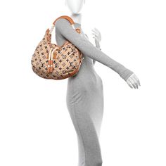 This is an authentic LOUIS VUITTON Canvas Monogram Cruise Bulles MM in Natural. This stylish shoulder bag is crafted of textured beige canvas with a Louis Vuitton monogram print. it features a twisted ivory rope and smooth vachetta cowhide leather handle with polished gold clasps. The top opens to a beige fabric interior with a zipper pocket. Stylish Shoulder Bag, Monogram Prints, Beige Fabric, Authentic Louis Vuitton, Leather Handle, Cowhide Leather, Louis Vuitton Monogram, Zipper Pocket, Louis Vuitton