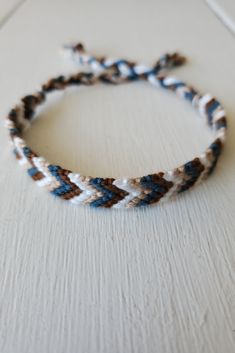 a close up of a bracelet on a table