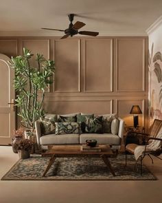 a living room filled with furniture and a large plant in the middle of the room