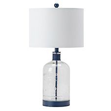 a glass lamp with a white shade on the top and blue trim around the base